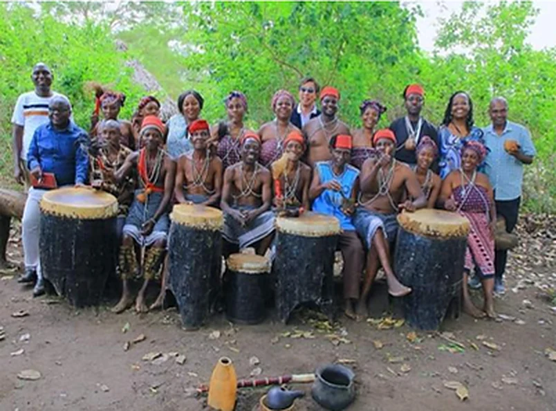 The Mwazindika dance group with their drums, gathered with festival guests.